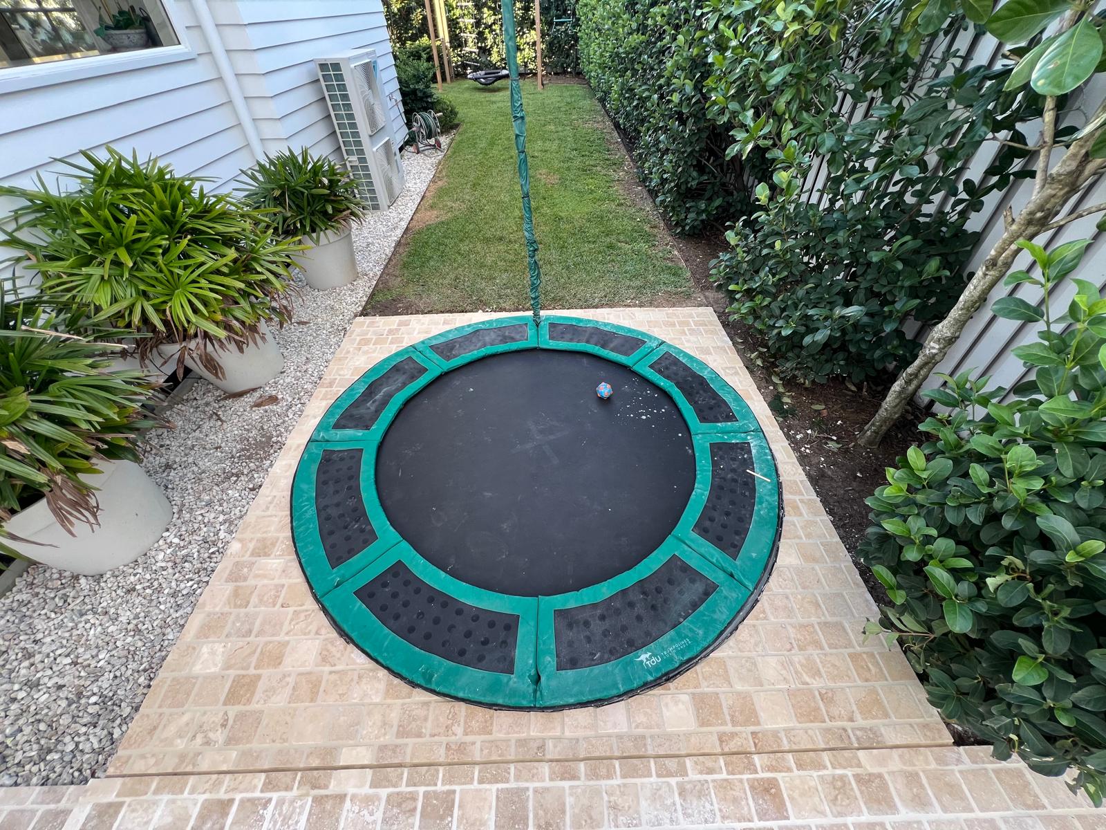 Precision tiling around a circular outdoor feature